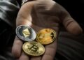 Two hands exchanging digital coins with a backdrop of blockchain graphics and financial symbols.