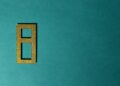 A digital illustration of a stablecoin symbol with gold bars in the background.