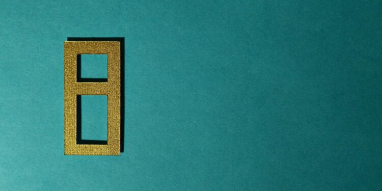 A digital illustration of a stablecoin symbol with gold bars in the background.