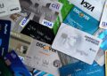 Nium's new card platform featuring stablecoins alongside Visa and Mastercard logos.