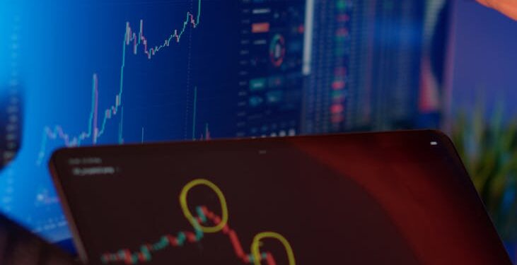 Graph showing Bitcoin and Ethereum price trends with a financial analyst in the background.