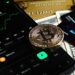 A credit card featuring cryptocurrency symbols and the Avalanche logo, symbolizing innovation in finance.
