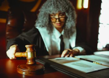 An Arizona courtroom with legal documents and a gavel, symbolizing regulatory actions.