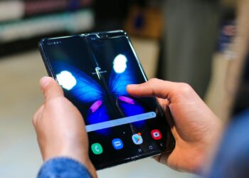 A smartphone displays Horizon Worlds, highlighting Meta's mobile focus.
