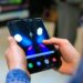 A smartphone displays Horizon Worlds, highlighting Meta's mobile focus.