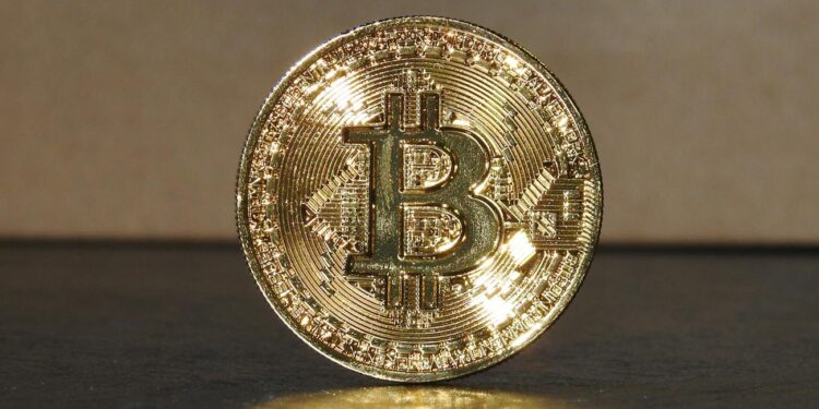 Investor hands holding a digital token symbolizing financial growth and investment in cryptocurrency.