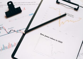 Swan Bitcoin logo with legal documents and financial charts in the background.