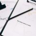 Swan Bitcoin logo with legal documents and financial charts in the background.