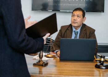 A courtroom scene with lawyers discussing cryptocurrency legal issues.