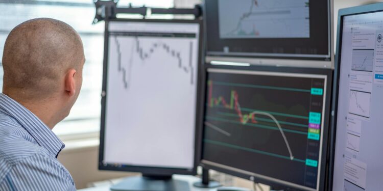 Traders monitor financial charts on multiple screens with S&P 500 logos in a digital trading hub.
