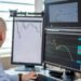 Traders monitor financial charts on multiple screens with S&P 500 logos in a digital trading hub.