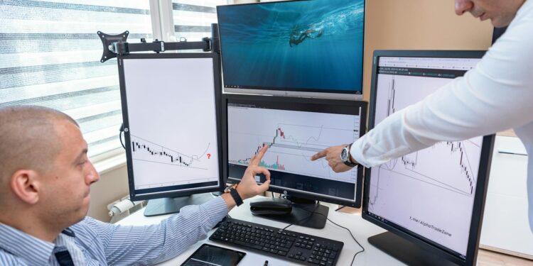 Traders analyzing crypto market trends on multiple screens in a bustling finance office.