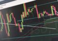 Naver Financial logo displayed alongside a graphic of fluctuating market charts.