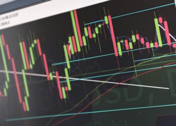 Naver Financial logo displayed alongside a graphic of fluctuating market charts.
