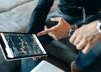Visa employees discussing AI technology related to cryptocurrency payments.
