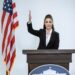 A politician gestures while announcing a ban on crypto donations to political parties.