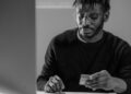 Forensic investigator analyzing digital data on cryptocurrency theft case.