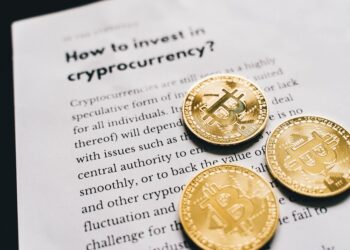 Investors discussing cryptocurrency trends at a financial conference.
