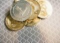 U.S. lawmakers discussing cryptocurrency regulation with digital tokens on a table.