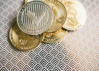 U.S. lawmakers discussing cryptocurrency regulation with digital tokens on a table.