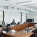 Trump sits at a conference table with Meta and Nvidia CEOs during a council meeting.