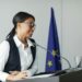 Kalshi co-founder speaking at a podium, addressing regulatory challenges in finance.