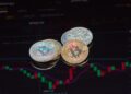 Oil barrels and a Bitcoin symbol with a fluctuating graph in the background.