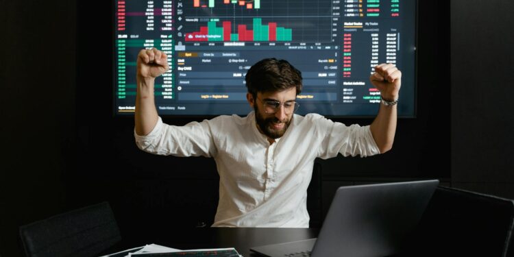 Trader celebrating a win at Polymarket, with a UFC fight backdrop and financial charts.