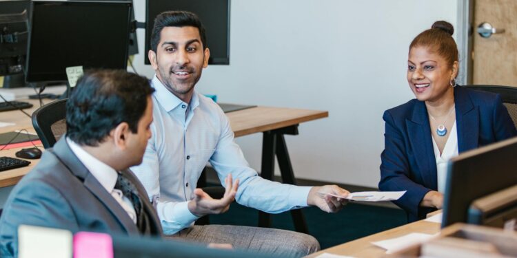 Fidelity employees discussing regulatory compliance for cryptocurrency services.