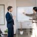 New CFO at Ledger with team members discussing growth strategies in a modern office setting.