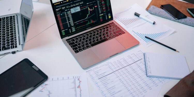 A screenshot of Kalshi's trading platform with regulatory documents in the background.