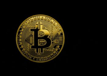 A close-up of a digital currency symbol overlaid on a map of Brazil, symbolizing expansion.