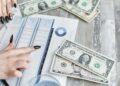 A distressed retiree looks at financial documents amid cryptocurrency symbols and dollar signs.