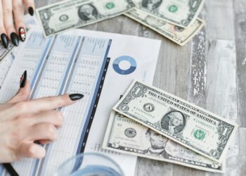 A distressed retiree looks at financial documents amid cryptocurrency symbols and dollar signs.