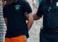 Spanish Civil Guard officers arrest a suspect involved in a crypto-related kidnapping case.
