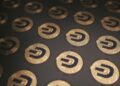 Coinbase logo with a backdrop of U.S. Capitol, symbolizing crypto regulation debate.