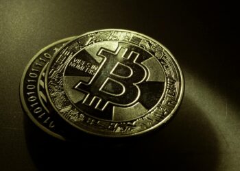 USDC coins with blockchain graphics representing enhanced payment integration.