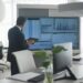 A financial analyst examines Bitcoin charts and ETF data in a modern office setting.