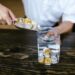 Gold coins and crypto tokens scattered on a table, representing stablecoin thUSD launch.