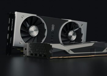 Close-up of a consumer GPU with digital AI graphics, symbolizing Tether's QVAC Fabric launch.