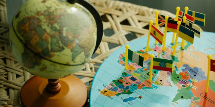 A digital representation of PayPal's PUSD stablecoin alongside a world map highlighting 70 countries.