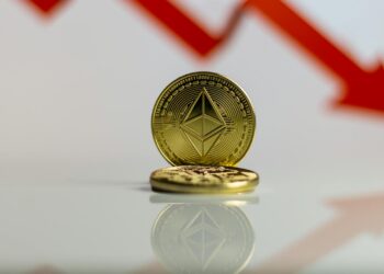 Graph showing Ethereum price drop with a large red downward arrow and company logo.