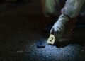 FBI agents gather evidence related to cryptocurrency scams during a major crackdown.