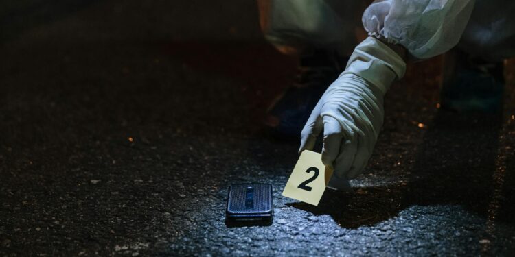 FBI agents gather evidence related to cryptocurrency scams during a major crackdown.