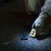 FBI agents gather evidence related to cryptocurrency scams during a major crackdown.