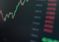 Stocks rising on a digital screen with financial graphs, symbolizing market optimism.