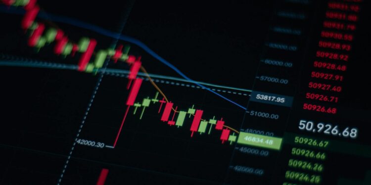 Stock market display showing a downward trend amid financial news and geopolitical tensions.