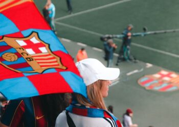 FC Barcelona players in jerseys alongside WhiteBIT branding, symbolizing crypto collaboration.