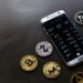 A smartphone displaying the X Platform's new auto-lock feature for crypto security.