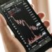 Bitcoin price chart showing a decline, with a backdrop of financial news headlines.